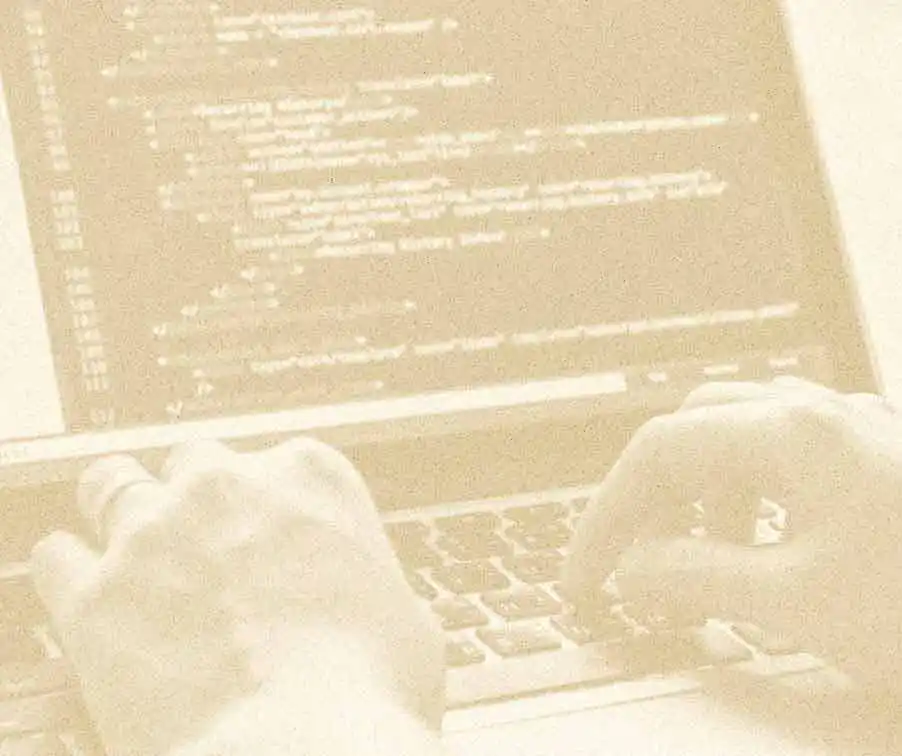 Image of hands on a keyboard typing code